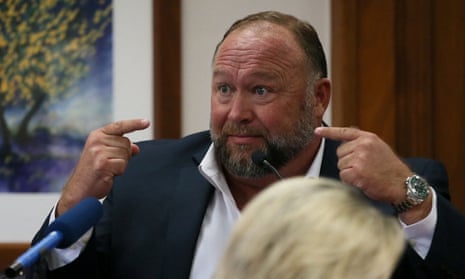 Alex Jones used his radio show to say those suing him had a nude photo of his wife. A lawyer clarified that it had been sent to a close Trump ally.