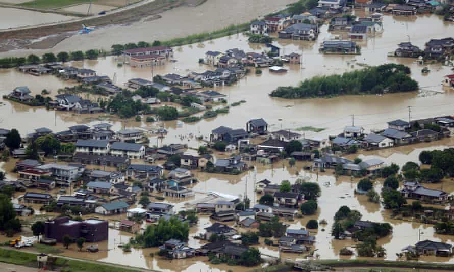 An aerial view of flooded homes in southwestern Japan, where more than 50 people have died due to extreme weather conditions.