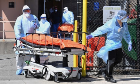 Medical staff move bodies from the Wyckoff Heights medical center to a refrigerated truck on Thursday in Brooklyn, New York. 