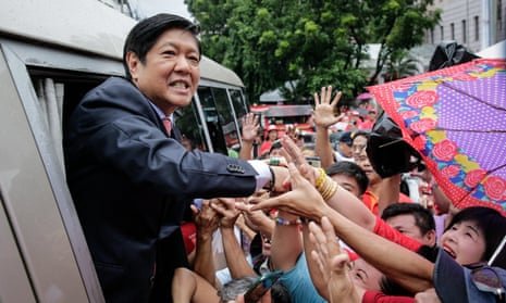 Ferdinand ‘Bongbong’ Marcos greets supporters outside the supreme court in Manila, Philippines on 11 July. 