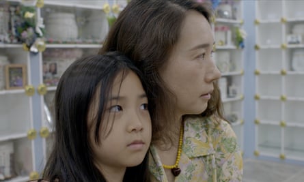 Jang Ji-sung and a child in a scene from the documentary Eternal You