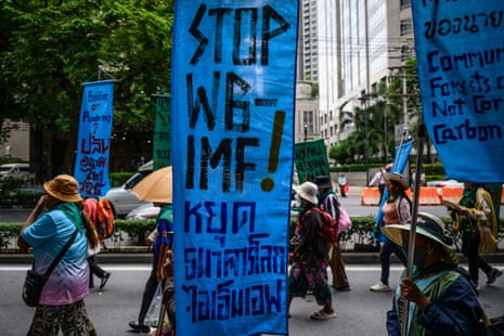 Demonstrators march during a protest against the International Monetary Fund (IMF) and World Bank Group in Bangkok on October 16, 2026, as the IMF Annual Meetings take place in the Thai capital.