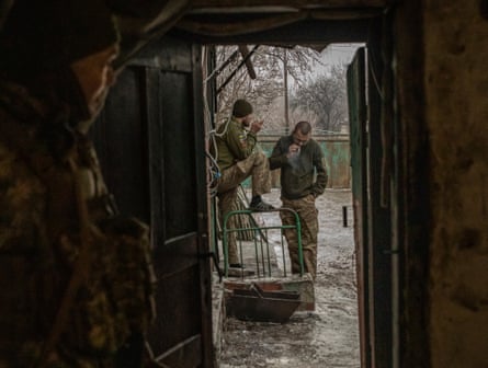 Two soldiers smoking outside