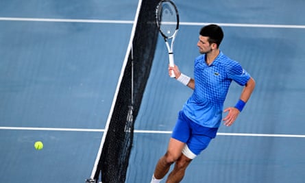 Novak Djokovic plays a drop shot during his victory over Tommy Paul
