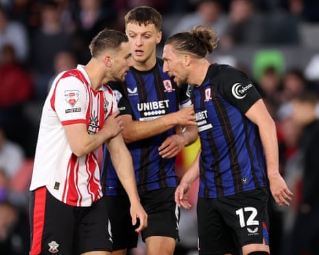 Taylor Harwood-Bellis of Southampton (left) clashes with Luke Ayling of Middlesbrough.