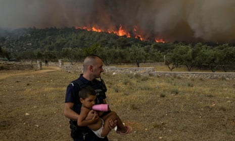 More than 1,000 children have been evacuated because of the wildfires near Athens, including some from the nearby village of Agios Charalampos