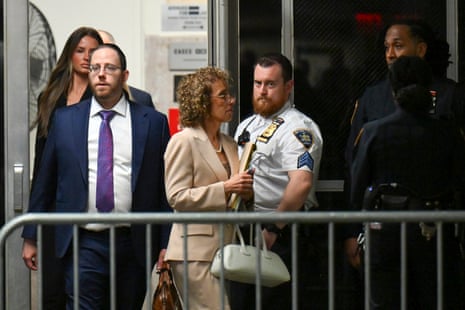 Susan Necheles, center, attorney for former President Donald Trump, walks to the courtroom after a break at Manhattan Criminal Court.