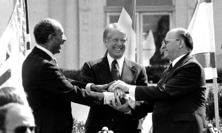Jimmy Carter, center, brokered the peace treaty between President Anwar Sadat of Egypt, left, and the Israeli prime minister, Menachem Begin, in 1979.