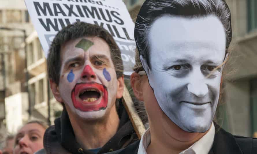 Activists dress as clowns to protest against US firm Maximus.