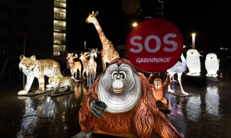 Life-size model animals with recorded noises are placed in front of the UN building in Bonn, Germany, during a protest to coincide with the start of the biodiversity summit in Montreal.