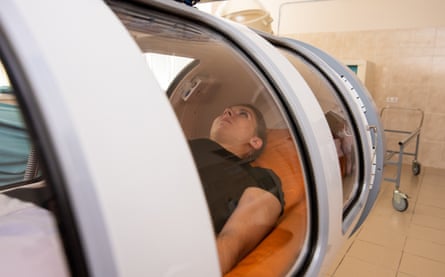 Breathing space: a patient in a hyperbaric chamber, where she will breathe pure oxygen at high pressures to help oxygenate her tissues and promote healing.