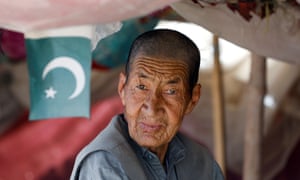 Ibrahim Hazara, 70, sells apricots from his push cart at a market