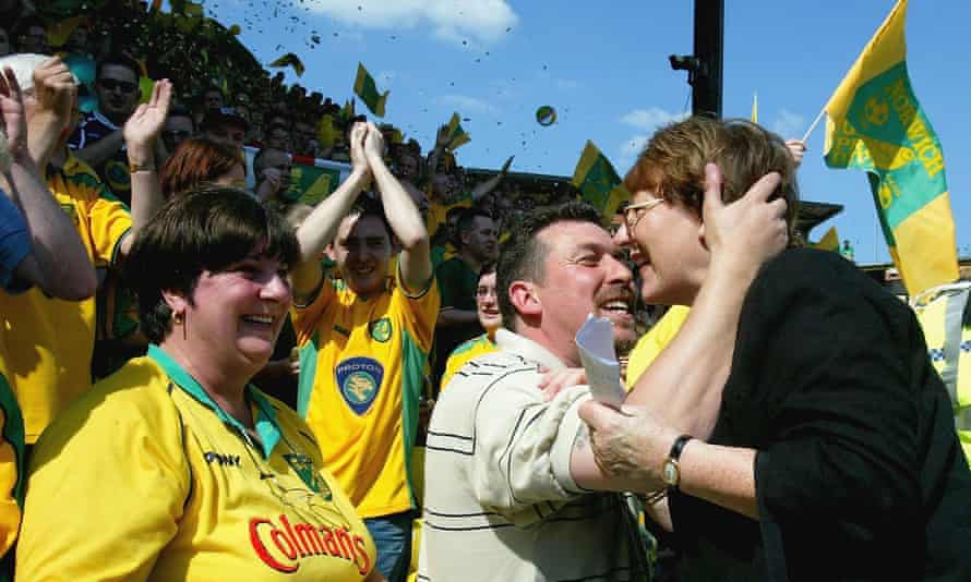 Delia Smith (right) celebrates with the Norwich supporters after they secured promotion to the Premier League in April 2004