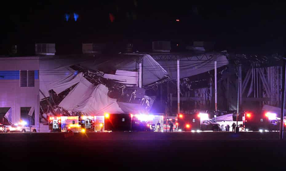 Emergency vehicles surround the Amazon distribution centre in Edwardsville, Illinois, after a storm caused the roof to collapse.