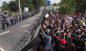 A barrier blocks a route for migrants