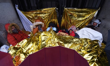 Venezuelan immigrants (l-r) Daniel, Yevely, Miguel Salazar, Vitoria, Iesta, Primari and Caren Ramirez shelter together in central Madrid
