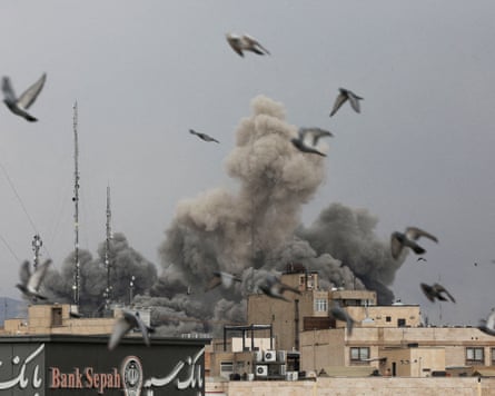 Smoke billows and birds scatter after an airstrike