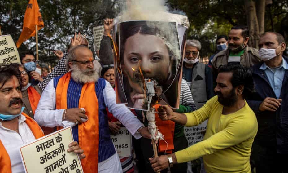 Activists burn an effigy depicting Greta Thunberg in Delhi