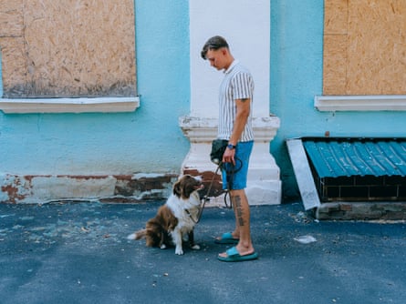 Bohdan, a soldier, posing with his dog Arnold.