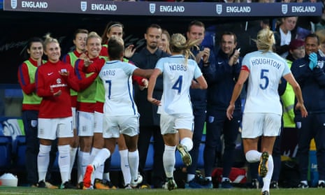 England players rush to celebrate their first goal with their manager, Marks Sampson during the 6-0 win over Russia at Prenton Park on Tuesday night.