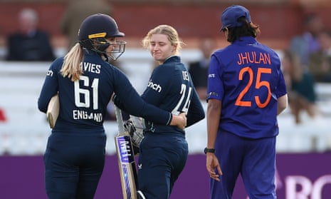 England’s Charlie Dean is consoled by Freya Davies after being run out by Deepti Sharma.