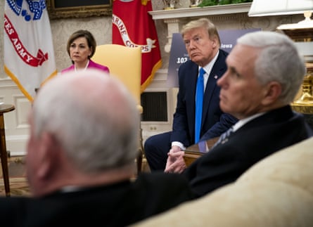 Kim Reynolds, governor of Iowa, from left, U.S. President Donald Trump listens and U.S. Vice President Mike Pence listen during a meeting in the Oval Office of the White House in Washington, D.C., U.S., on Wednesday, May 6, 2020. Trump fixed his course on reopening the nation for business, acknowledging that the move would cause more illness and death from the pandemic but insisting it’s a cost he’s willing to pay to get the economy back on track.