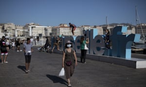 A woman at Marseille port in face mask.