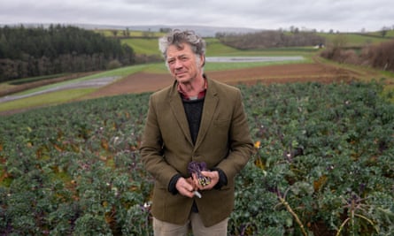 Guy Singh-Watson in a field of broccoli