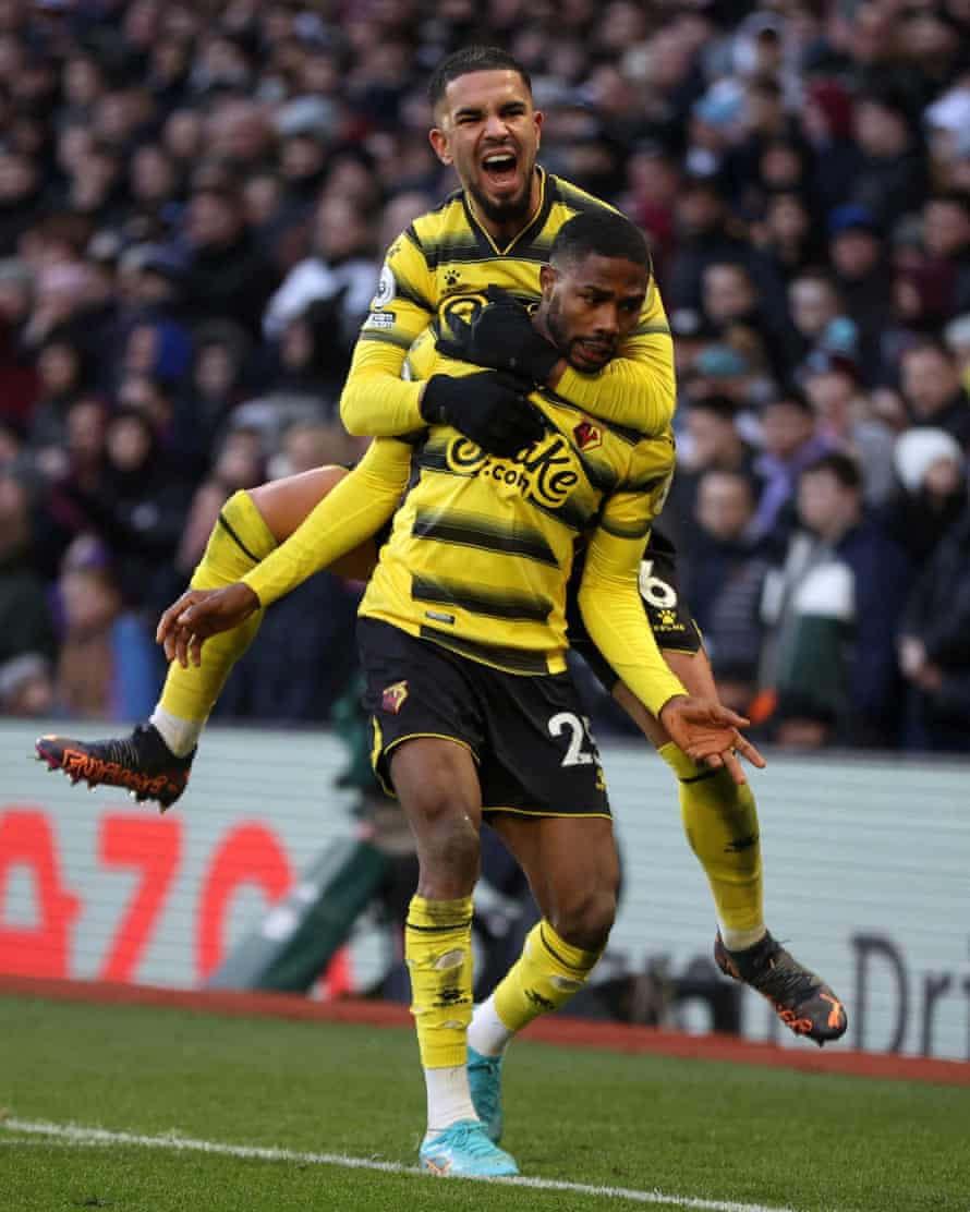 Emmanuel Dennis is congratulated by teammate Imran Louza after his winner at Aston Villa.