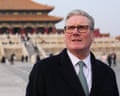 Keir Starmer with a large traditional Chinese palatial building behind
