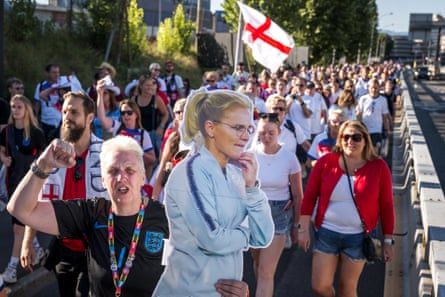 An England’s supporter holds a life-size cardboard cutout of England’s coach Sarina Wiegman as she arrives at the semi-final.