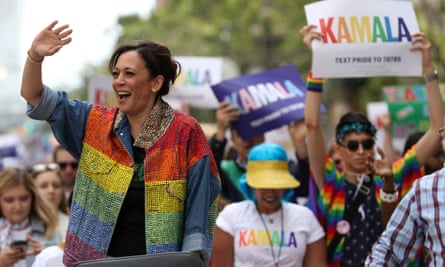 Kamala Harris waves to the crowd as she rides in a car during the San Francisco pride parade in California on 30 June.