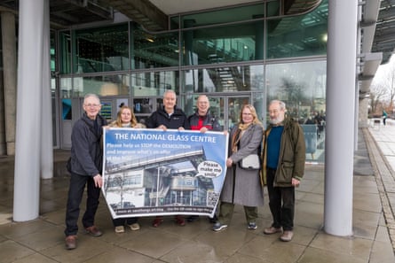 Campaigners from the Save the National Glass Centre with a banner outside.
