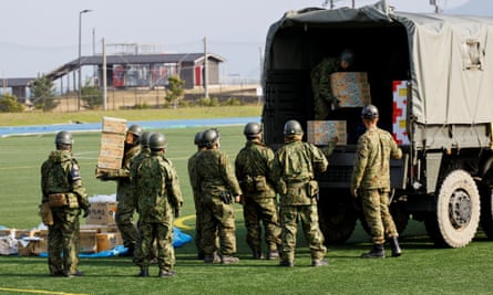 Members of Japan’s self-defence forces in Wajima, Ishikawa prefecture, prepare aid supplies to be taken to isolated villages after the earthquake