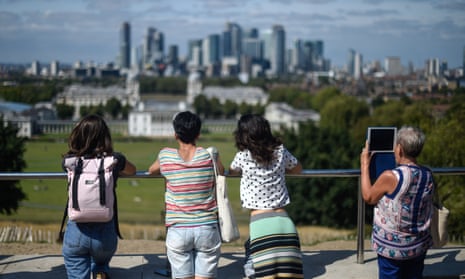 People look out at the London skyline from Greenwich Observatory.