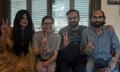 Ahmad Farhad, his wife, Syeda Urooj Zainab, and lawyers, hold their hands up in the peace sign