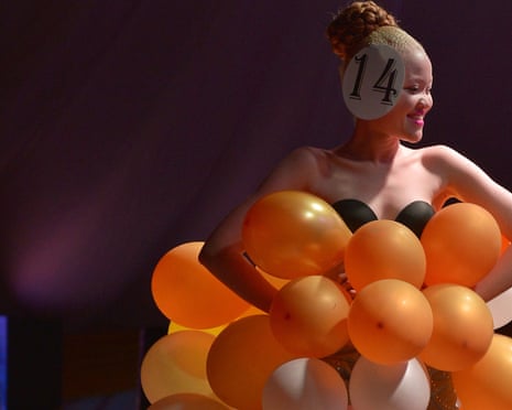 A contestant walks down the catwalk in her own creation.