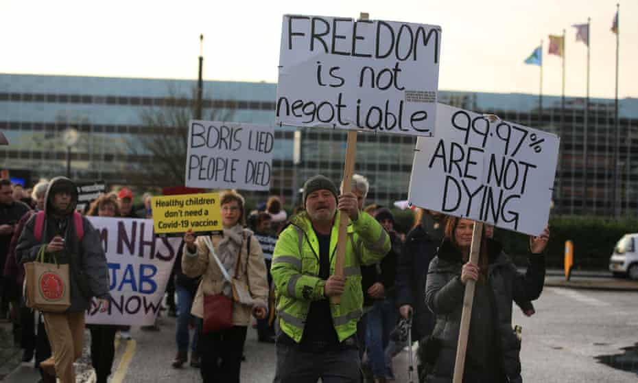 Protesters gather at beginning of a ‘Freedom Rally’ to protest Covid restrictions in Milton Keynes, England