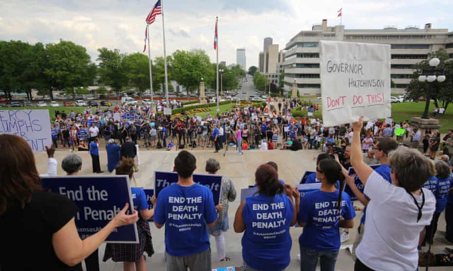 People gather at a rally opposing Arkansas’ upcoming executions on Friday in Little Rock.