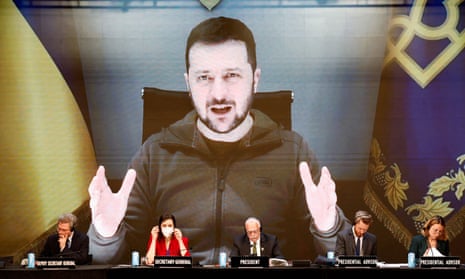 Volodymyr Zelenskiy speaking via video link during the 68th annual session of the Nato parliamentary assembly in Madrid, Spain, 21 November.