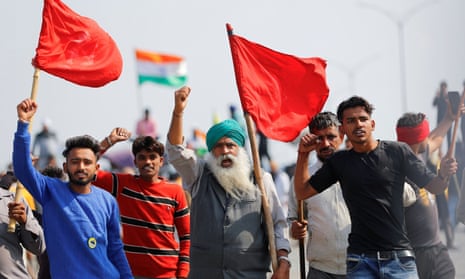 Farmers taking part in a three-hour ‘chakka jam’, or road blockade, as part of protests against farm laws on a highway on the outskirts of Delhi.
