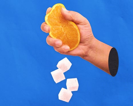 an orange being squeezed and some sugar lumps falling out