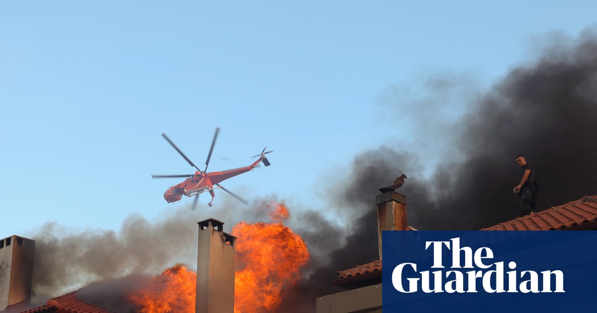 Wildfire burns through northern suburb of Athens as residents told to evacuate