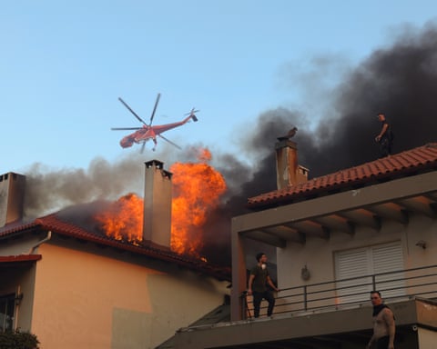 Building in flames with helicopter overhead dqxikeidqkikdinv