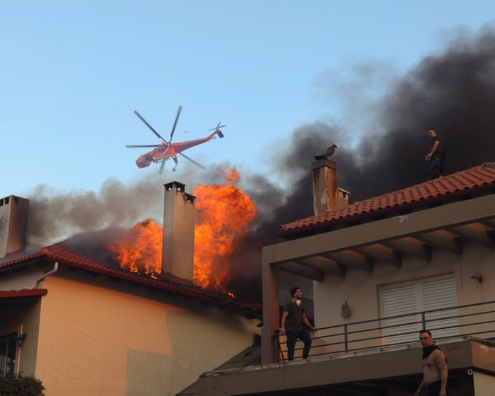 Wildfire burns through northern suburb of Athens as residents told to evacuate