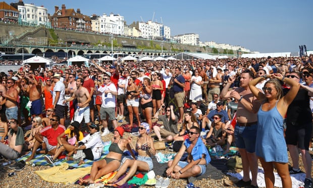 Fans watch the World Cup quarter-final between England and Sweden at the Luna Beach Cinema in Brighton.