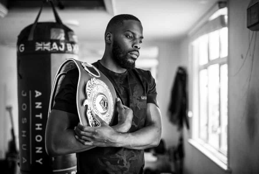 Lawrence Okolie, the British professional boxer who recently won the WBO cruiserweight title, poses for a portrait in the tiny gym at the bottom of his garden in Woodford Green on April 6th 2021.