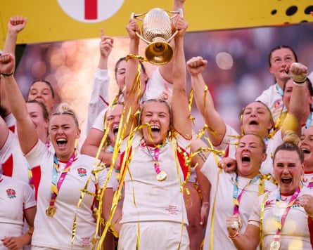 Zoe Aldcroft celebrates with the trophy during after the World Cup final.