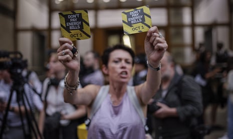 A woman protests outside Ofgem's headquarters in London in August. The UK relies on gas to heat homes and generate electricity and has western Europe’s least energy-efficient homes.