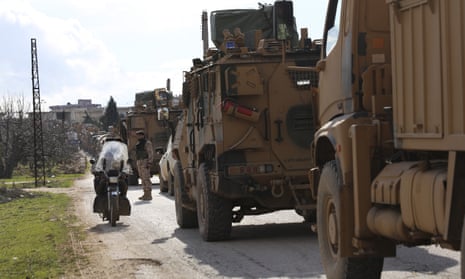 Turkish military convoy stops in Idlib province, Syria.